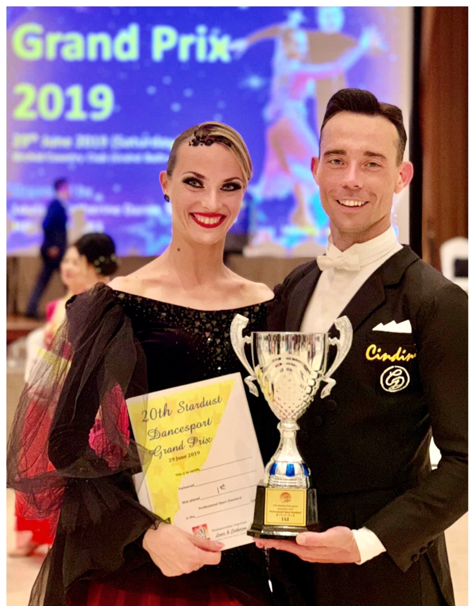 Mikhail and Olesya Eremeev, Galaxy Dance Academy founders, with championship trophy